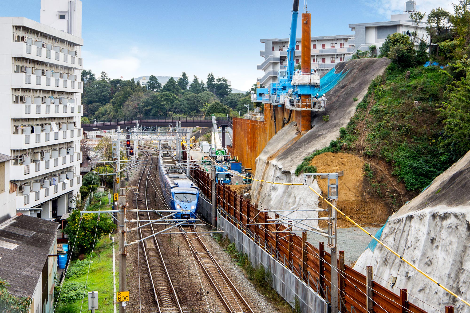 A retaining wall installed on a steep railway embankment